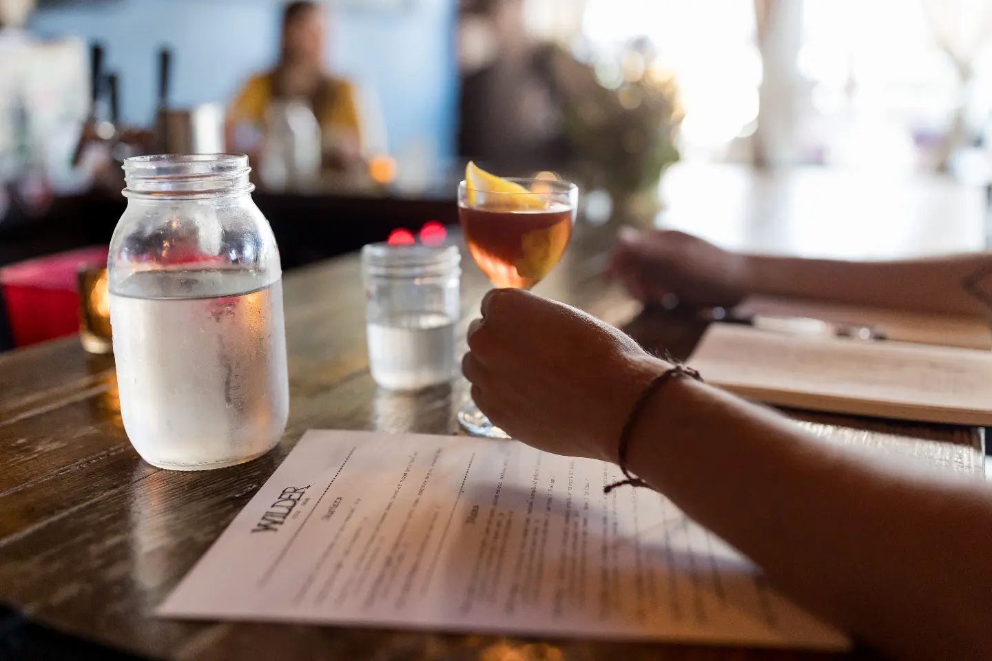 A customer enjoying a cocktail at Portland bar, Wilder - photo by Jenny Kang Photography