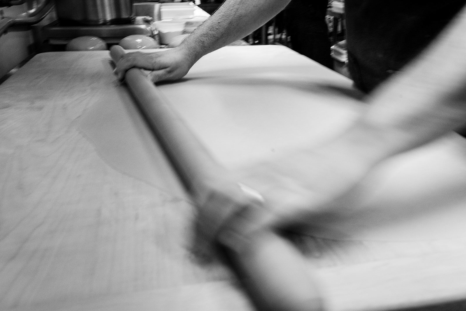 Hands rolling pasta dough at Pastificio d'Oro in Portland, OR - photo by Jenny Kang Photography